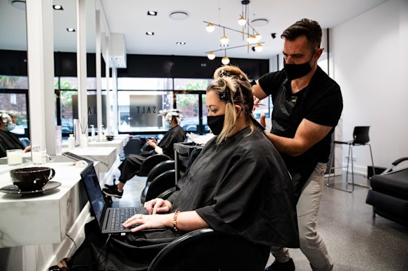 Hair dresser Tony Boutsalis from Salt hair in Coogee with customer Helen Appleton. 