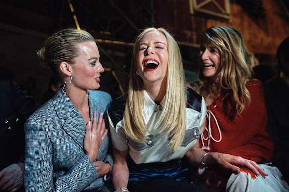 Margot Robbie, Nicole Kidman, and Laura Dern, right, laugh during the Calvin Klein fashion show at the Fashion Week in New York.