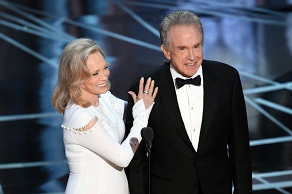 'I thought he was joking': Faye Dunaway, left, and Warren Beatty before announcing the Oscar for best picture.