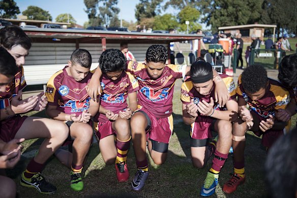 The team conducts an Islamic prayer just before a Christian prayer before kick off.