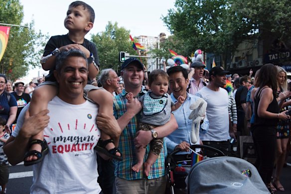 Crowds march down Oxford St, Darlinghurst this evening to celebrate the majority yes vote of the results of the postal vote.