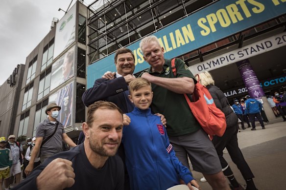 Cricket fans Richard Rudzki, Scott Patterson, Teddy Rudzki and father Stefan outside the MCG ahead of the Boxing Day test