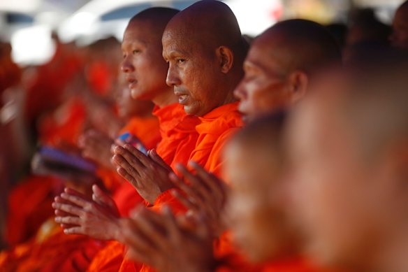 Thai Buddhist monks pray for 12 boys and their soccer coach went missing, in Mae Sai, Chiang Rai province, in northern Thailand.