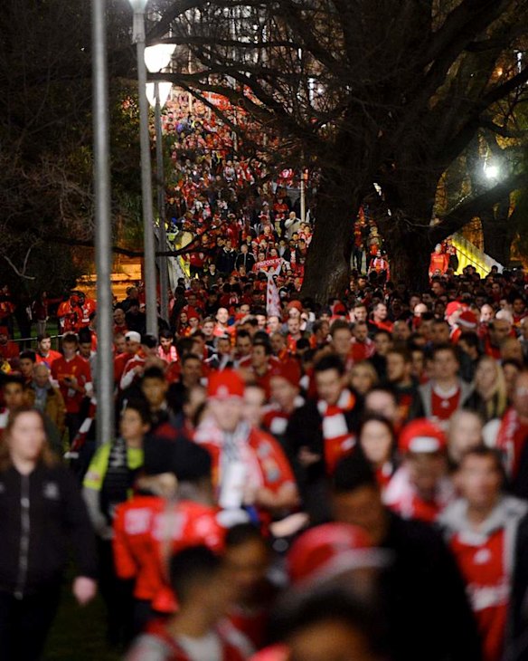 Liverpool fans make their way to the MCG for the game against  Melbourne Victory.