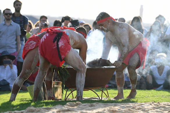 Koomurri dancers perform a smoking ceremony during the Australia Day Wugulora Morning Ceremony.