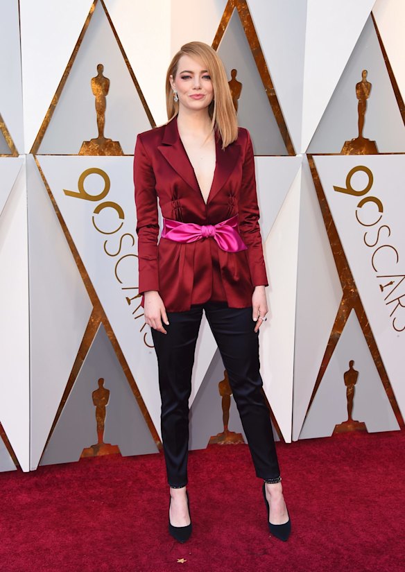 Emma Stone arrives at the Oscars.
