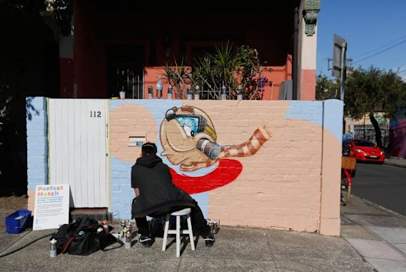 Sid Tapia creating his artwork in Newtown as part of the Perfect Match street art program.