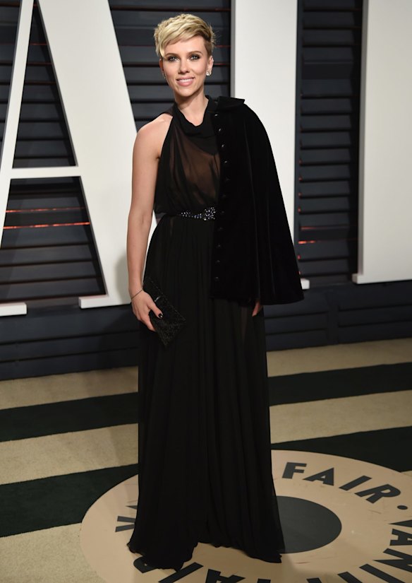 From a fairy bread inspired dress at the Oscars ceremony Scarlett Johansson changed it up with this black halter-neck Alaia gown with matching cape.