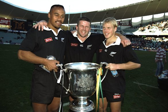 29 July 1995:  Jonah Lomu (left), Sean Fitzpatrick (centre) and Jeff Wilson (right) of New Zealand hold the Bledisloe Cup after winning the final against Australia in Sydney, Australia. New Zealand won the match 34-23.