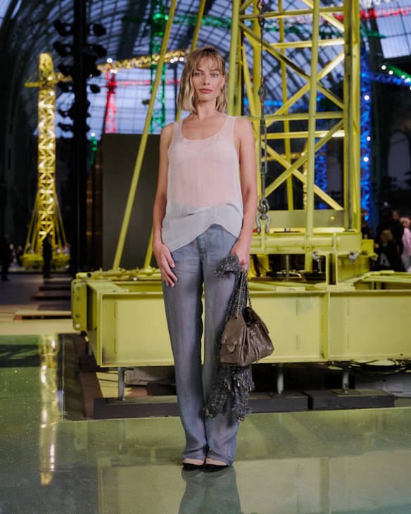 Robbie is wearing a sheer Chanel outfit, but it was her hair that stole the show.