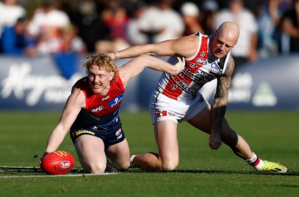 That’s mine: Clayton Oliver wins possession, but Zak Jones had the better of the Demons midfielder on Sunday.