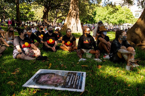At the Invasion Day rally, a sign in memory of Nathan Reynolds who died in custody at J.Morony Correctional Centre. 