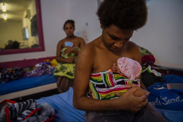 Sula Savya, 16, with baby Francesca and Lamancha Kalau, 20, with her baby. The Port Moresby Maternity ward practices kangaroo care, entailing skin to skin contact. 