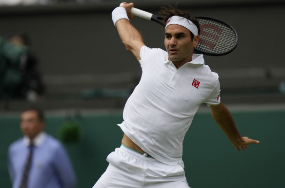 Federer plays a return during the men’s singles against Norrie. 