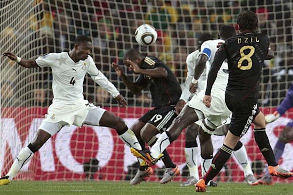 Germany's Mesut Ozil (8) shoots to score a goal past Ghana's goalkeeper Richard Kingson.