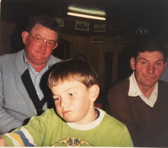 Michael, centre, as a young boy with his dad Lionel, left, and uncle Lenny, right. 