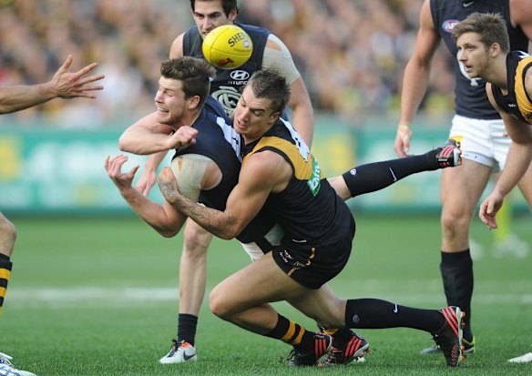 Richmond's Dustin Martin tackles Carlton's Bryce Gibbs.
