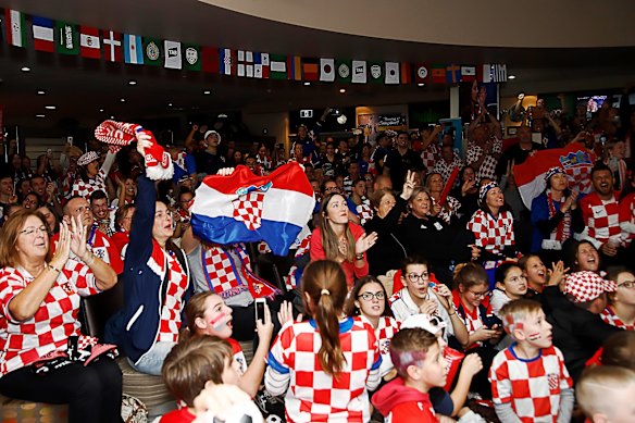 Fans celebrate after the FIFA World Cup semi-final between Croatia and England at King Tom Club in Sydney.