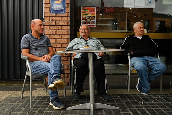 Property developer Stefan Maroun (left) sits with friends, Moses Nisser and Joseph Wakim  at a cafe in Harris Park. 