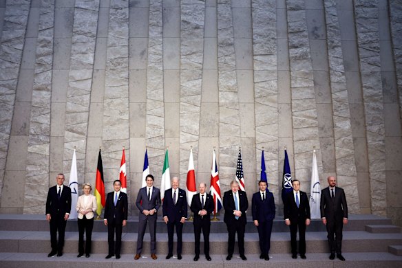 NATO Secretary-General Jens Stoltenberg, European Commission President Ursula von der Leyen, Japan's Prime Minister Fumio Kishida, Canada's Prime Minister Justin Trudeau, US President Joe Biden, Germany's Chancellor Olaf Scholz, British Prime Minister Boris Johnson, France's President Emmanuel Macron, Italy's Prime Minister Mario Draghi and European Council President Charles Michel pose for a G7 leaders' photo during a NATO summit on Russia's invasion of Ukraine, at the alliance's headquarters in Brussels, Belgium.