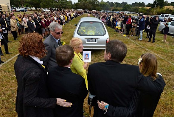 Luke's friends and family form a guard of honour.