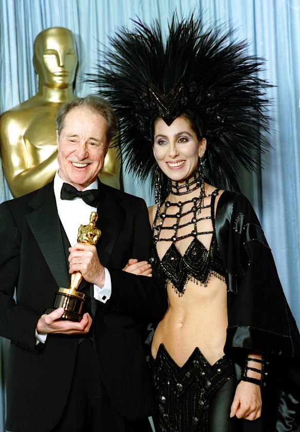 Cher wears a Mackie creation as she poses with actor Don Ameche after presenting him with the Oscar for best supporting actor in 1986.