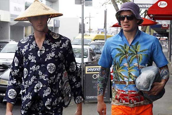 Collingwood footballers Alan Toovey (left) and Luke Ball arrive at the Rising Sun Hotel in Richmond in costume for the club's Mad Monday celebrations after the Magpies won their first Premiership in 20 years. 
