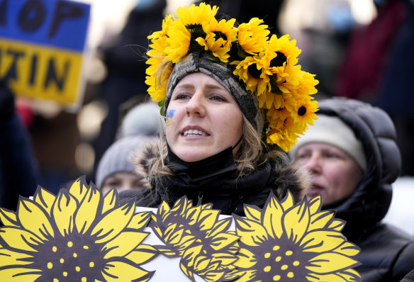 A person wears a crown of sunflowers as they rally against Russia’s invasion of Ukraine during a protest outside City Hall in Ottawa, Ontario, last month. A number of Ukrainian immigrants live in Canada.