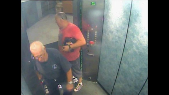 Glen McNamara, holding a six pack of James Boags under his arm, with Roger Rogerson in the lift of McNamara's Cronulla apartment on May 20, 2014 - the day Jamie Gao was killed.