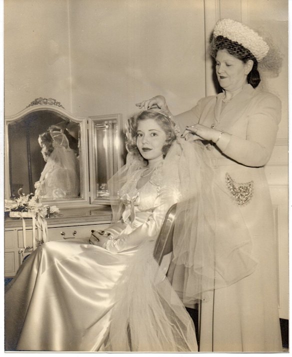 A satin-clad bride in the early 1950s.