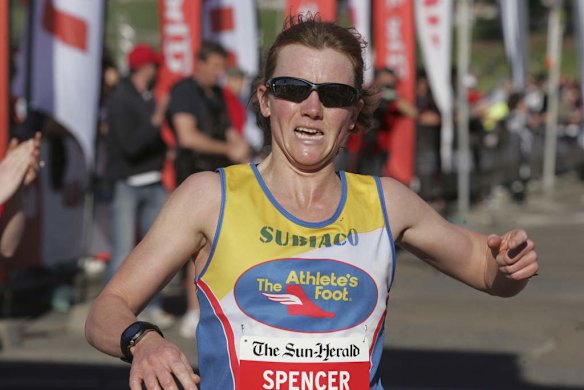 City 2 Surf: Female winner Linda Spencer crosses the line to win the 2013 race.