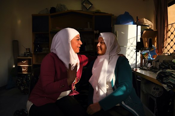 Syrian refugees Lara Shaheen, 36, years old (left) talks with her mopther Hasnaâ al-Beesh, 56 years old (right) in the sewing room at Jasmine Foundation in Irbid, Jordan. Lara set up business, the Jasmine Foundation, to train and help women from Syria. Lara's former fiance, Abdalwahhab, a Youtube activist was killed by ISIS. 