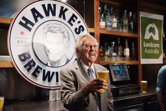 Bob Hawke pours a glass of his namesake brew. April 2017.