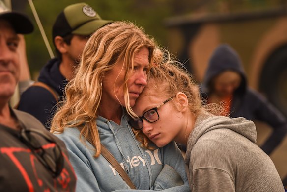 People stranded in Mallacoota are evacuated on to the HMAS Choules.