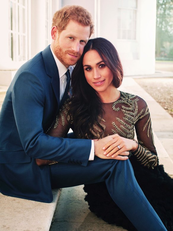 Prince Harry and Meghan Markle pose for one of two official engagement photos, at Frogmore House, in Windsor, England. 