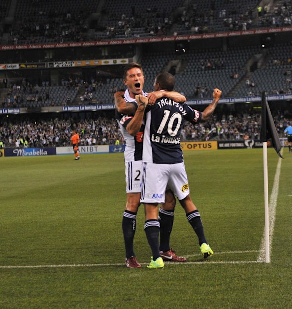 Melbourne Victory v Brisbane Roar at Etihad Stadium.   Archie Thompson celebrates his second goal with Harry Kewell. 5th November 2011
