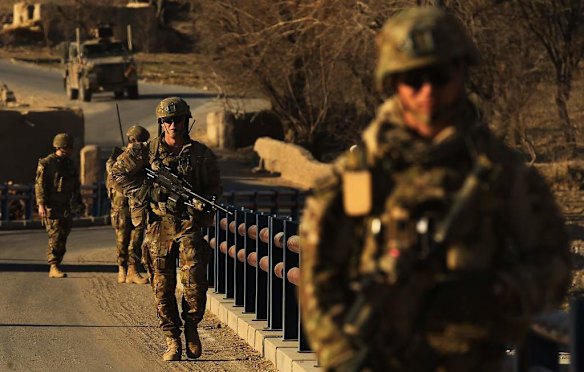 Australian soldiers patrol and search the Puza Bridge for IED's after an insurgent was arrested the night before with explosive matieral at this location. Dai Roshan Area in Uruzgan Province, Afghanistan.