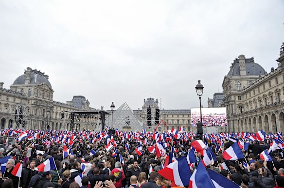 A general view as voters are waving flags during Emmanuel Macron speech as he celebrates his Presidential election victory At Le Louvre In Paris on May 7, 2017 in Paris, France. Emmanuel Macron won the French Presidential election over extreme right candidate Marine Le Pen. (Photo by Aurelien Meunier/Getty Images)