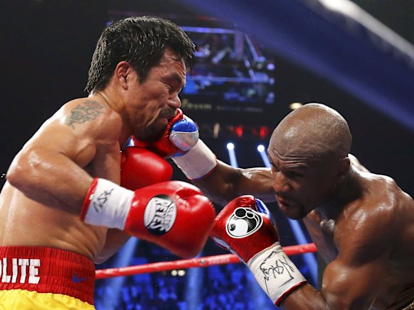 Manny takes a punch from Floyd.