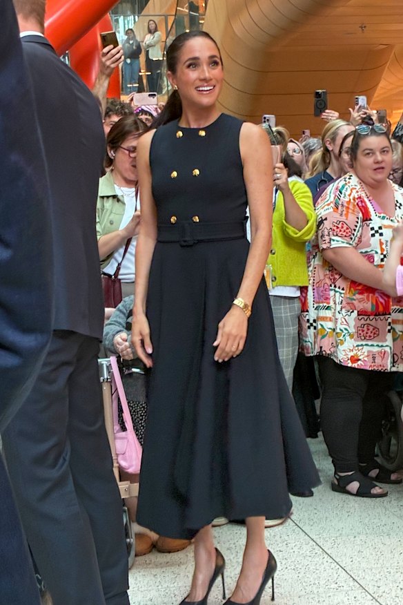 Meghan wearing the Priscilla dress made by Sydney designer Karen Gee.