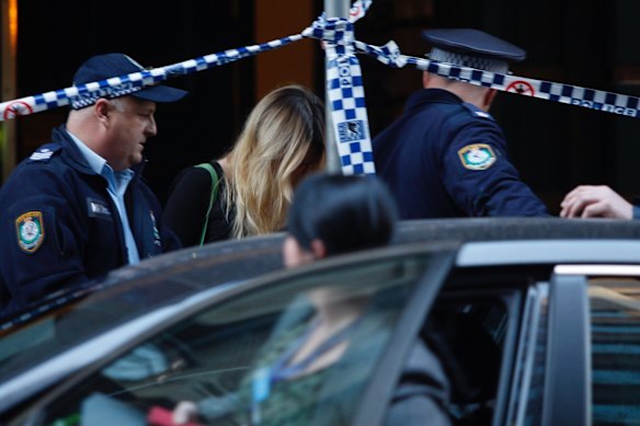 An unidentified woman leaves 118 Clarence Street on Tuesday afternoon.