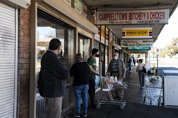 Daily life during COVID at the Campbelltown Butchery & Chicken Shop, as locals queue practising social distancing during lockdown.