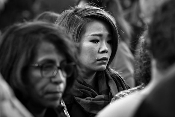 Faces of Paris. Parisians silently paid respect to the 129 people killed in the terror attack in Paris across many memorial sites including Le Carillon bar on Sunday 15 November.