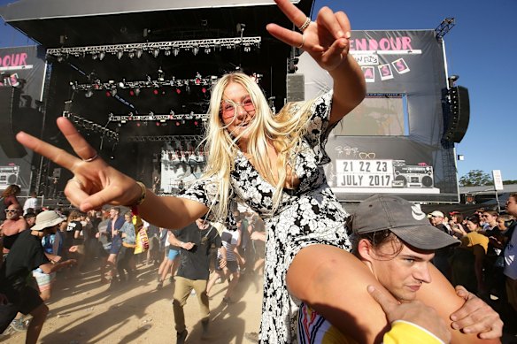 A festival goer watches Luca Brasi perform.