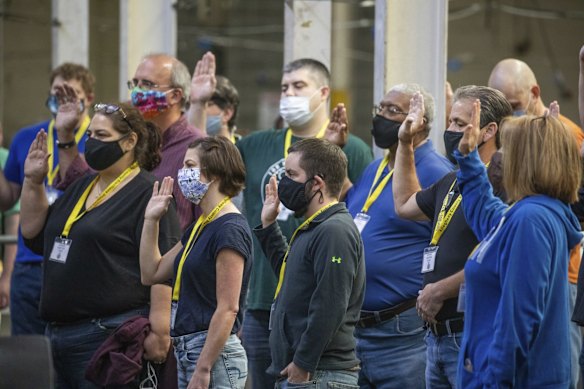 Allegheny County Return Board is sworn in to process the remaining absentee and mail-in ballots on Friday in Pittsburgh. 