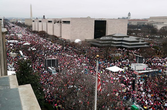 A crowd fills Independence Avenue with the Washington Monument in the background, during the Women's March on Washington.