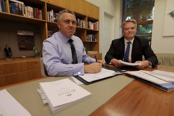 Treasurer Joe Treasurer poses with the Budget papers and his Budget speech with Finance minister Senator Mathias Cormann.