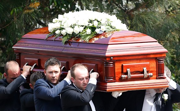 Australian cricket captain Michael Clarke helps carry the coffin of Phillip Hughes.