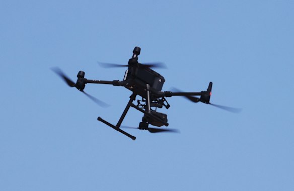 Police fly a drone in the search for Cleo Smith. 