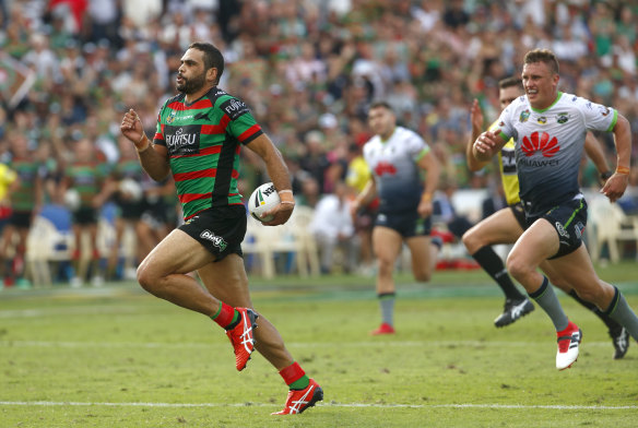 Intercept: Greg Inglis of the Rabbitohs races clear before scoring at at the Central Coast Stadium.